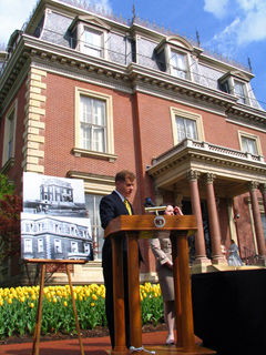 Blunt in front of mansion