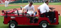 Molina carted off the field (Bill Greenblatt, UPI)