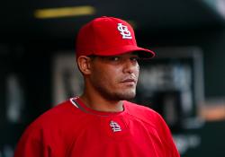 Molina watching from the dugout (Bill Greenblatt, UPI)