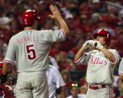 Shane Victorino greeted by Pat Burrell after his HR (Bill Greenblatt, UPI)