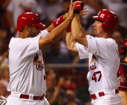 Ludwick congratulated by Pujols after his first inning homer (Bill Greenblatt, UPI)