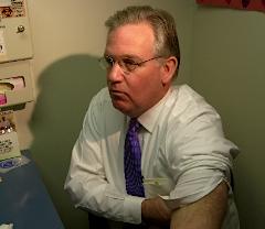 Governor Nixon rolls up his sleeve for a flu shot