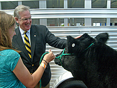 Governor Nixon with Dozer the steer and Claire Martin of Curryville