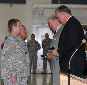 Bond, Nixon present flags to oldest, youngest in company