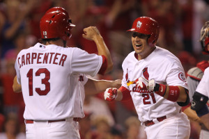 St. Louis Cardinals Allen Craig (21) prepares to celebrate his grand slam home run with teammates as he crosses home plate in the seventh inning against the Cincinnati Reds at Busch Stadium in St. Louis on August 26, 2013.  St. Louis won the game 8-6. UPI/Bill Greenblatt