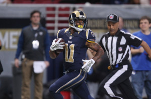 St. Louis Rams Tavon Austin looks around for a defender as he takes the football  65 yards for a touchdown in the first quarter against the Chicago Bears at the Edward Jones Dome in St. Louis on November 24, 2013. UPI/Bill Greenblatt