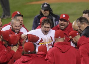 St. Louis Cardinals David Freese celebrates with his teammates at home place after hitting a solo walk off homerun to win game 6 of the World Series in the 11th inning against the Texas Rangers in St. Louis on October 27, 2011. The Cardinals defeated the Rangers 10-9 and the series is tied 6-6. UPI/Bill Greenblatt