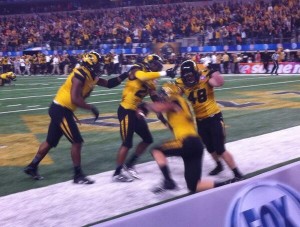 Shane Ray and members of  Mizzou's defense celebrate the clinching touchdown.