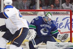 Eddie Lack makes a pad save on David Backes. (Photo, Jeff Vinick, NHL.com)