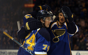 St. Louis Blues teammates skate in to congratulate T.J. Oshie (74) after he scored a goal against the Phoenix Coyotes in the first period at the Scottrade Center in St. Louis on January 14, 2014.   UPI/Bill Greenblatt