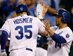 Eric Hosmer is greeted at home plate by Omar Infante after hitting a home run Tuesday night. (MLB/photo)