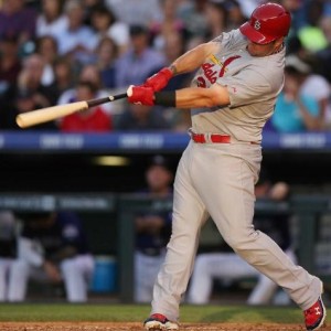 Matt Adams connects for a solo home run against the Rockies (photo/MLB)