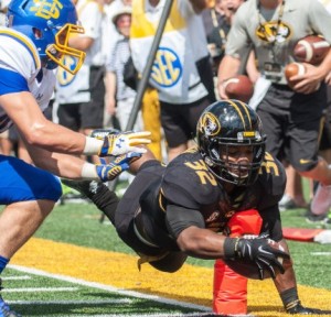 Russell Hansbrough hits the pylon on his way to a Missouri touchdown (photo/Mizzou Athletics)