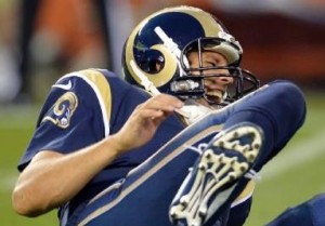 Sam Bradford yells out in pain after getting hurt in the first quarter (photo/NFL)