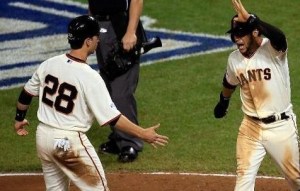 Buster Posey and Gregor Blanco celebrate the go-ahead run for the Giants in the sixth (photo/MLB)