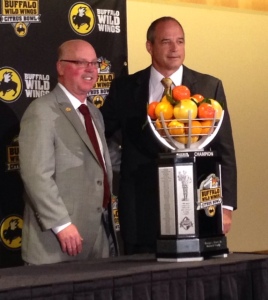 Minnesota head coach Jerry Kill (L) stands with Missouri head coach Gary Pinkel and the Citrus Bowl Trophy (photo/Bill Pollock, Missourinet)