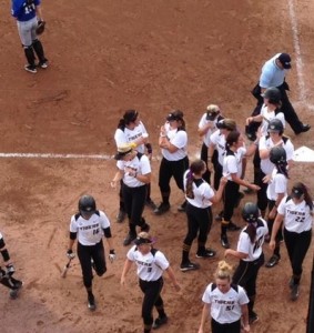 Teammates celebrate Jordan Zolman's home run