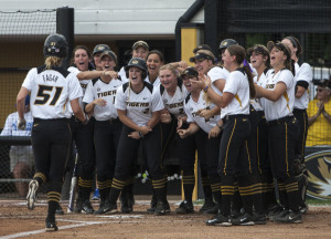 Sami Fagan is greeted at home after her first inning home run (photo/Mizzou Athletics)