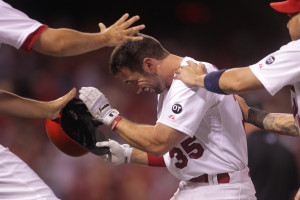 St. Louis Cardinals Greg Garcia is mobbed by teammates after taking a walk, resulting in the winning run crossing the plate against the Colorado Rockies in the ninth inning at Busch Stadium in St. Louis on July 30, 2015. St. Louis won the game 9-8.   Photo by Bill Greenblatt/UPI