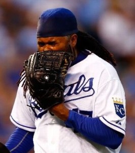 Johnny Cueto yells into his glove following a three-home night (photo/MLB)