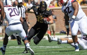 Tyler Hunt runs over and through the UConn defense for a big gain (photo/Mizzou Athletics)