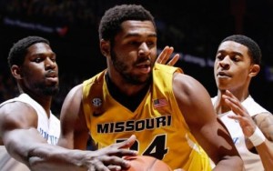 Mizzou's Kevin Puryear is hounded under the basket by two Wildcat defenders (photo/UK Athletics)