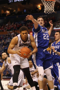 Missouri State's Loomis Gerring pulls down a rebound in front of Drake's Casey Schlatter in the first half of the State Farm Missouri Valley Tournament at the Scottrade Center in St. Louis on March 3, 2016. Photo by Bill Greenblatt/UPI