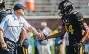 Emanuel Hall (84) is greeted by Barry Odom after his second quarter touchdown (photo/Mizzou Athletics)