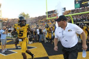 Missouri Tigers head coach Barry Odom and Alex Ross lead their team onto the field to take on the Georgia Bulldogs at Faurot Field in Columbia, Missouri on September 17, 2016. Photo by Bill Greenblatt/UPI