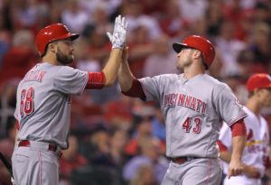 Cincinnati Reds Scott Schebler (R) is congratulated by Tim Adleman as he crosses home plate in the fourth inning against the St. Louis Cardinals at Busch Stadium in St. Louis on September 26, 2016. Cincinnati scored seven times in the inning.   Photo by Bill Greenblatt/UPI