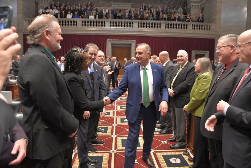 Gov. Mike Kehoe shakes hands with state lawmakers (Photo by Tim Bommel, House Communications)